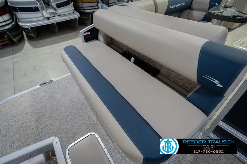 Slide: The Image of 2026 Bennington 21 SLJ boat interior with beige and blue seating. - 39