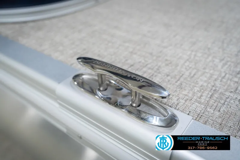 Slide: The Image of 2026 Bennington 21 SLJ boat cleat detail with Reeder-Trausch Marine logo. - 52