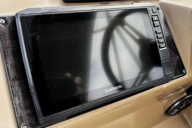Slide: The Image of Garmin display on 2019 Harris Sunliner 250 boat dashboard, showing steering wheel reflection. - 14