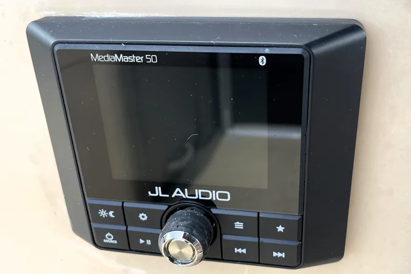 Slide: The Image of JL Audio MediaMaster 50 control panel on 2019 Harris Sunliner 250 boat. - 15