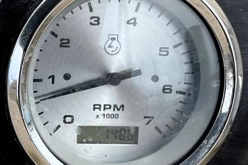Slide: The Image of Close-up of a 2019 Harris Sunliner 250 RPM gauge displaying 1,486 RPM. - 17