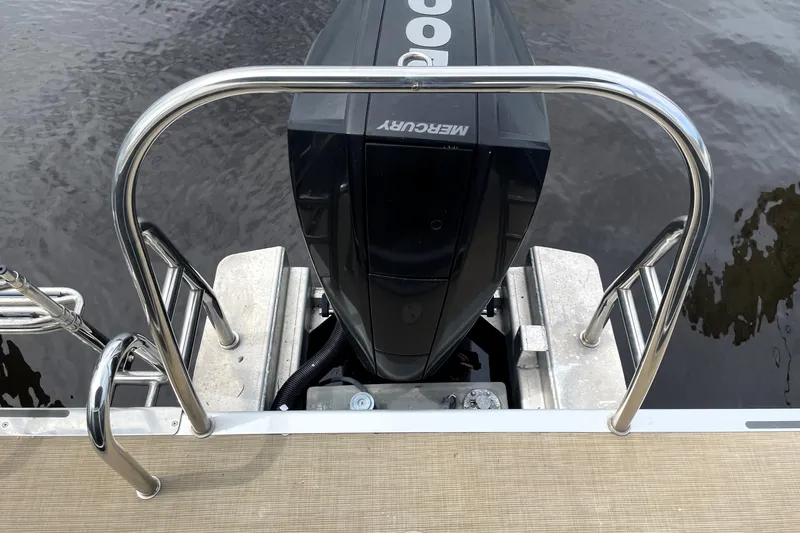 Slide: The Image of 2019 Harris Sunliner 250 boat with Mercury outboard motor and stainless steel ladder. - 22