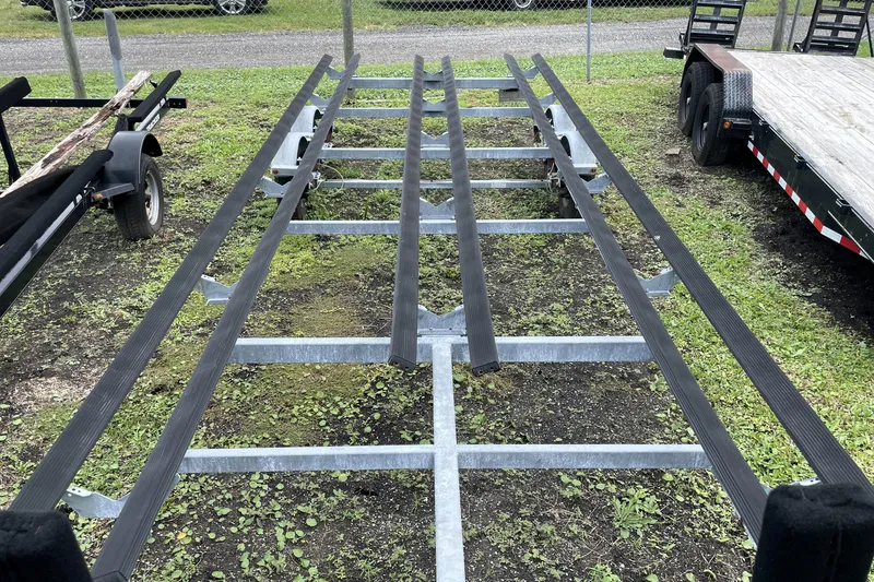 Slide: The Image of Trailer frame for 2019 Harris Sunliner 250, parked on grassy area. - 39