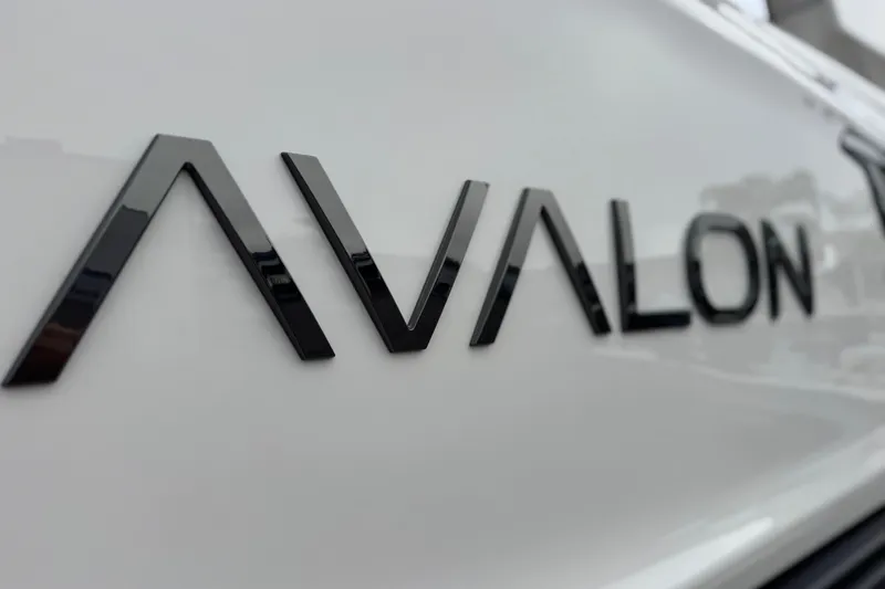 Slide: The Image of Close-up of 2026 Avalon Excalibur 27' logo on sleek white surface. - 13