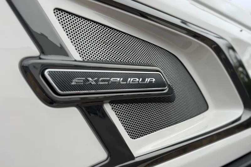 Slide: The Image of Close-up of 2026 Avalon Excalibur 27' logo on a sleek, modern grille design. - 14