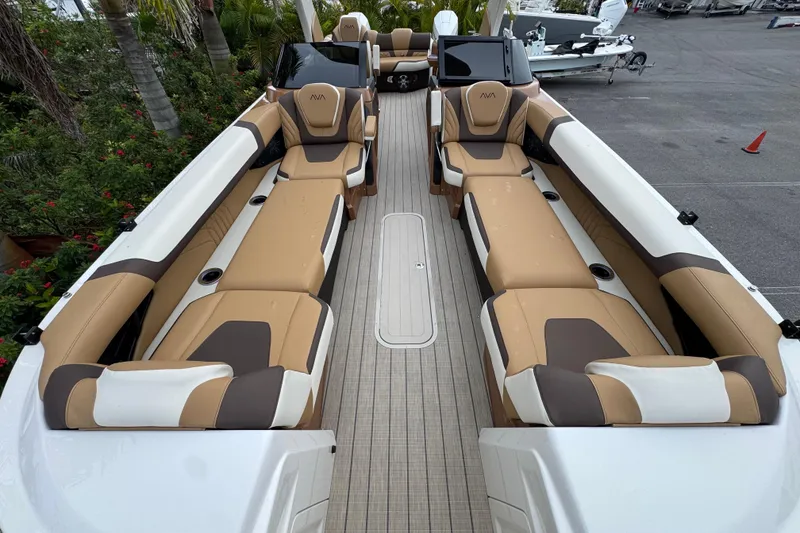 Slide: The Image of Luxurious interior of 2026 Avalon Excalibur 27' boat with tan and brown seating. - 18