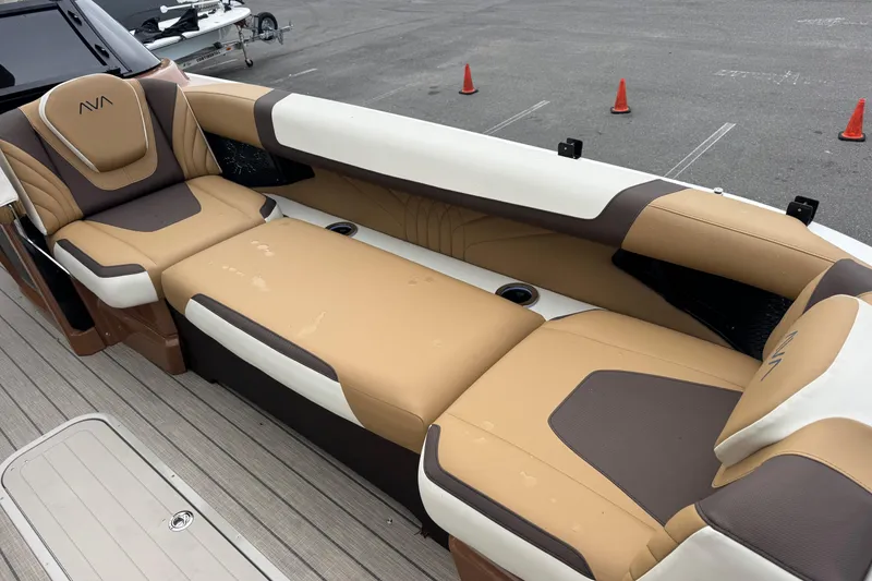 Slide: The Image of Luxurious seating on 2026 Avalon Excalibur 27' boat, featuring tan and brown upholstery. - 19