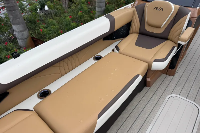 Slide: The Image of Luxurious seating on 2026 Avalon Excalibur 27' boat with tan and brown upholstery. - 21