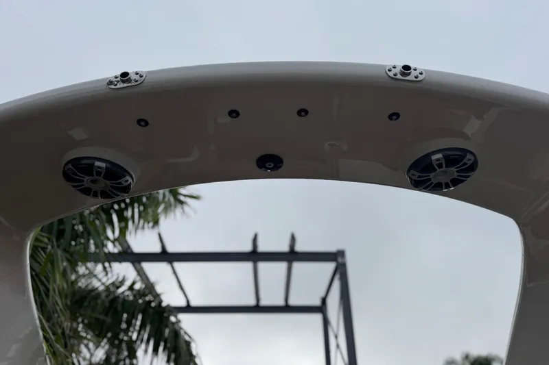 Slide: The Image of 2026 Avalon Excalibur boat speakers and canopy, with palm trees in the background. - 23