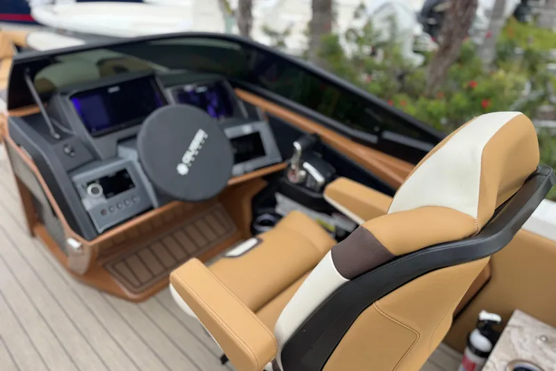 Slide: The Image of Luxurious helm of 2026 Avalon Excalibur 27' boat with modern controls and seating. - 28