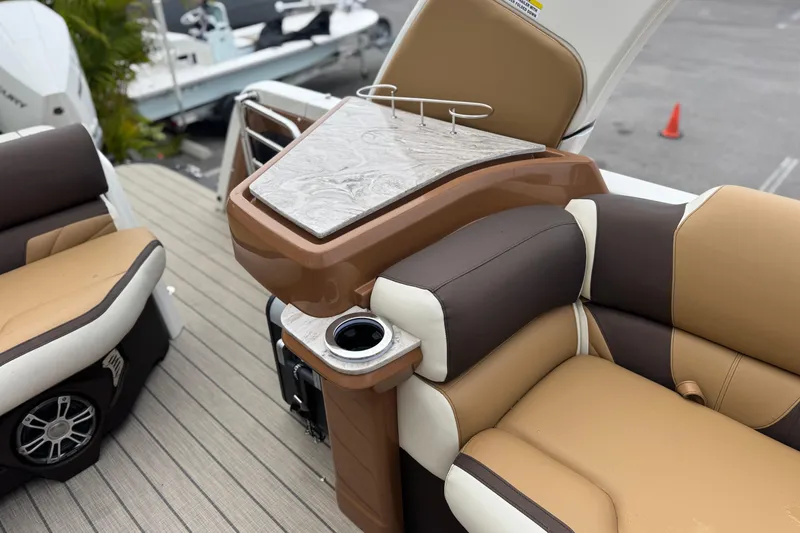 Slide: The Image of Luxurious seating and table on 2026 Avalon Excalibur 27' boat, featuring elegant design and comfort. - 34