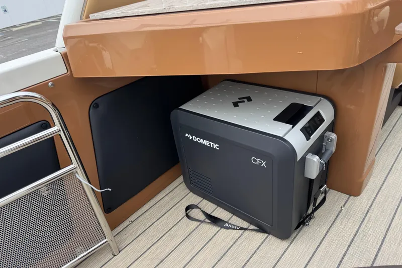 Slide: The Image of 2026 Avalon Excalibur boat interior with Dometic CFX cooler on deck. - 35