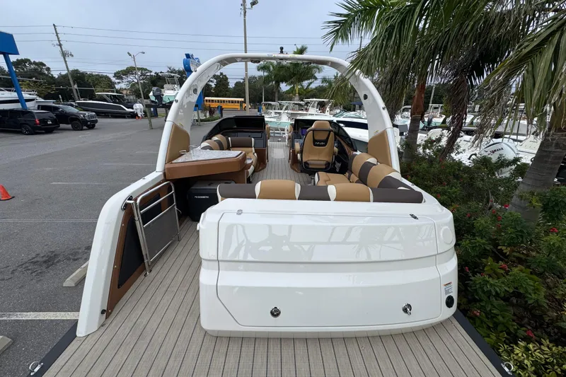 Slide: The Image of 2026 Avalon Excalibur 27' boat with luxurious seating and modern design in a marina setting. - 39