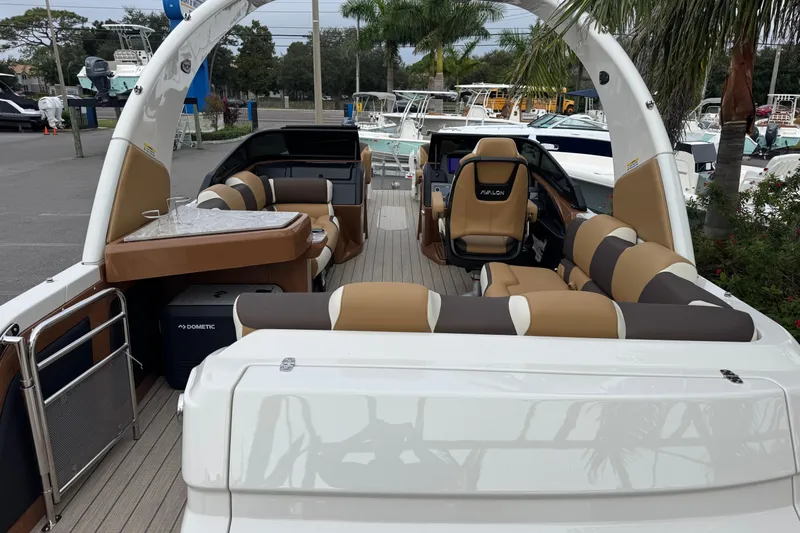 Slide: The Image of 2026 Avalon Excalibur 27' boat interior with luxurious seating and modern design. - 40