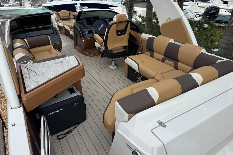 Slide: The Image of Luxurious 2026 Avalon Excalibur 27' boat interior with plush seating and modern amenities. - 41