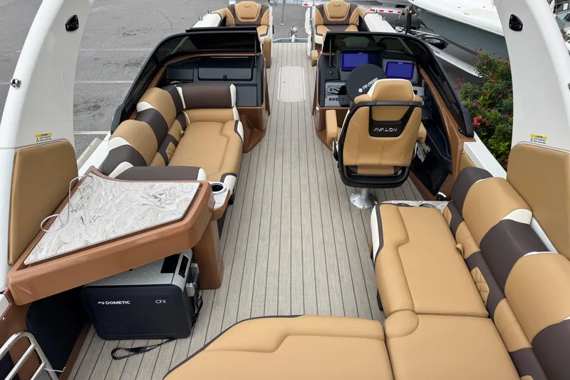Slide: The Image of Luxurious 2026 Avalon Excalibur 27' boat interior with plush seating and modern amenities. - 42