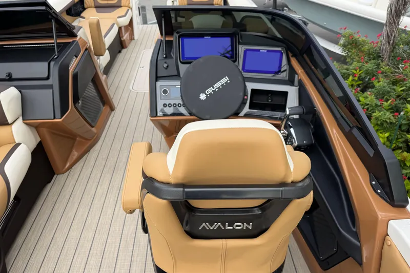 Slide: The Image of Luxurious interior of 2026 Avalon Excalibur 27' boat with modern dashboard and seating. - 45