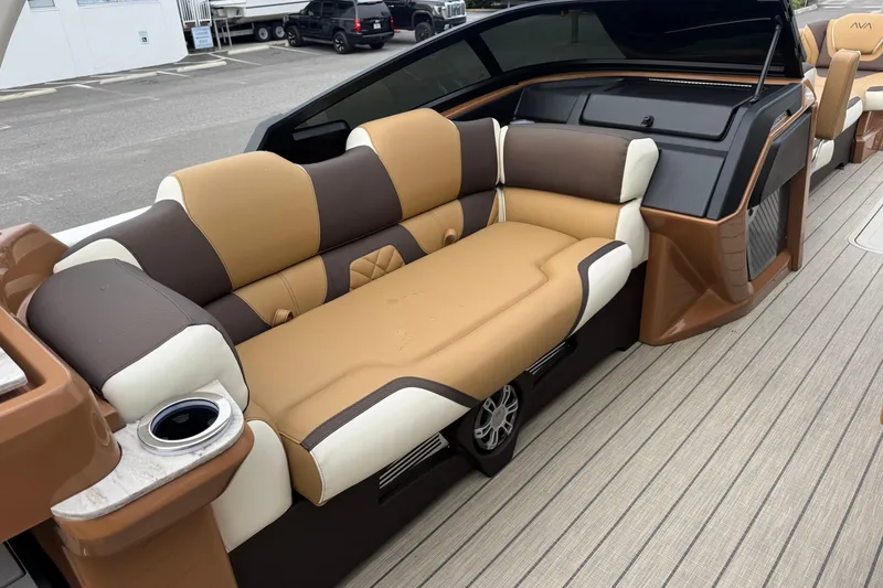 Slide: The Image of Luxurious seating on 2026 Avalon Excalibur 27' boat with brown and cream upholstery. - 46