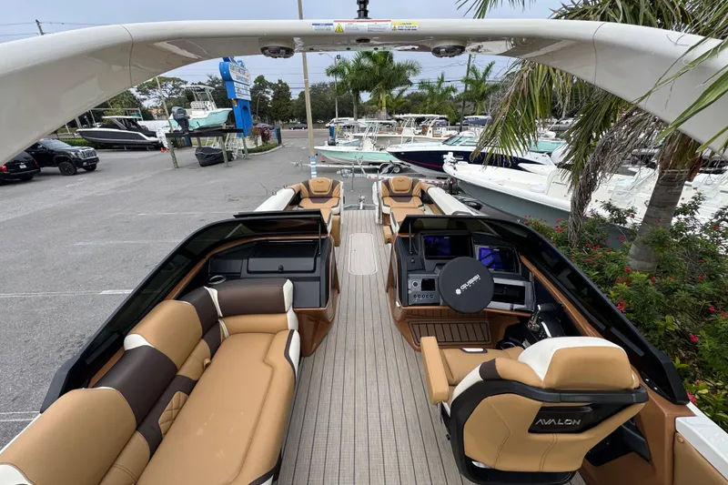 Slide: The Image of Luxurious 2026 Avalon Excalibur 27' boat with elegant seating and modern dashboard. - 47