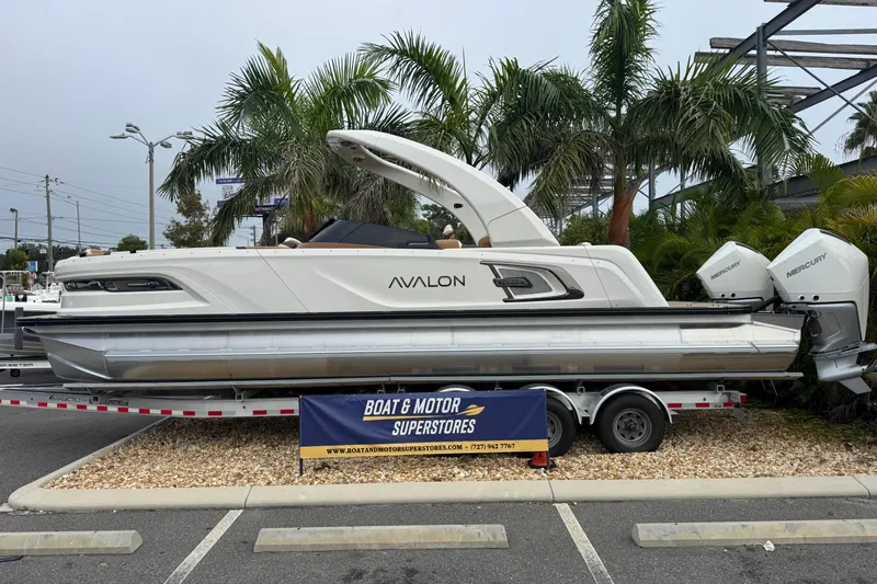 Slide: The Image of 2026 Avalon Excalibur 27' boat on trailer, displayed at Boat & Motor Superstores. - 8