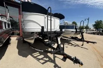 Slide: The Image of 2026 Sun Tracker Party Barge 16 DLX pontoon boat on trailer. - 3