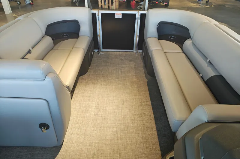 Slide: The Image of 2026 Sun Tracker Party Barge 20 DLX interior with spacious seating and modern design. - 20