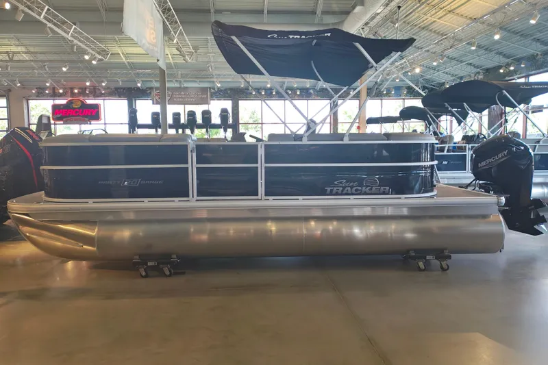 The Image of 2026 Sun Tracker Party Barge 20 DLX pontoon boat displayed in showroom. - 0