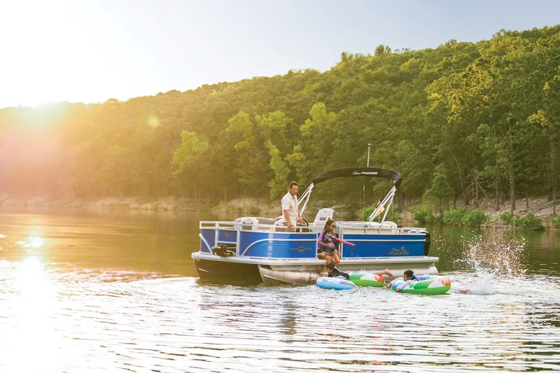 Slide: The Image of 2026 Sun Tracker Fishin' Barge 20 DLX interior with seating and storage compartments. - 9