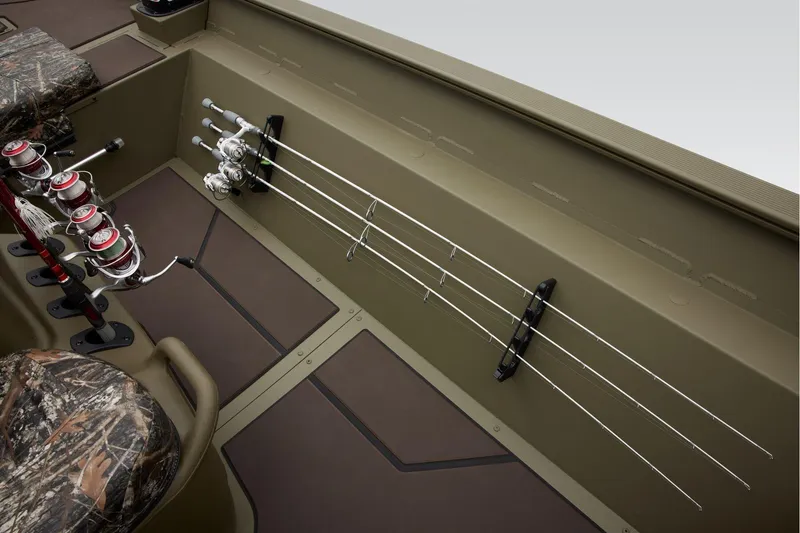 Slide: The Image of 2026 Tracker Grizzly 2072 CC boat interior with camo design and steering wheel. - 19