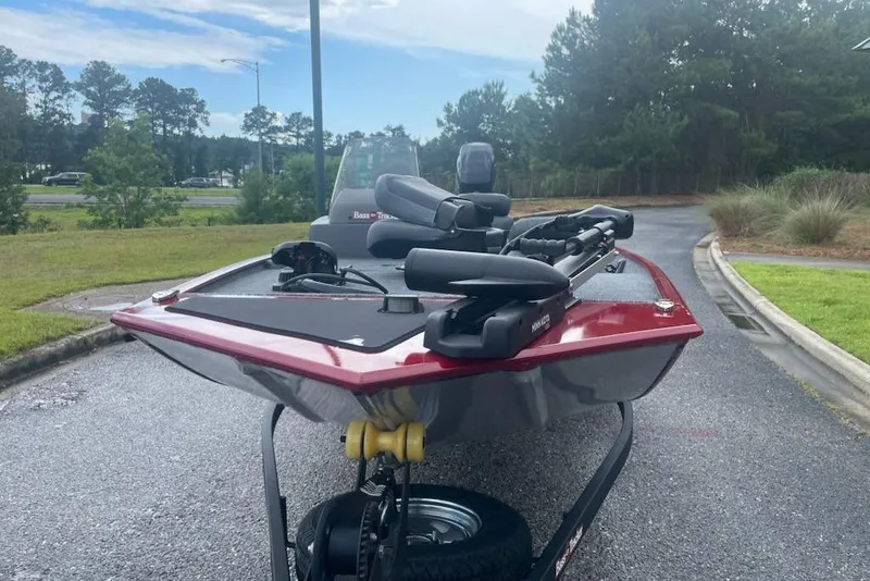 Slide: The Image of 2026 Tracker Bass Tracker Classic XL boat on trailer, parked on a scenic road. - 62