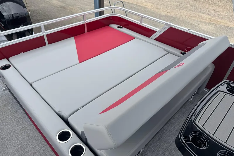 Slide: The Image of 2026 Sun Tracker Party Barge 22 RF DLX with red and gray seating area. - 13