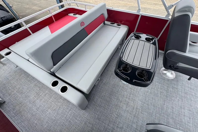 Slide: The Image of 2026 Sun Tracker Party Barge 22 RF DLX interior with seating and cup holders. - 16