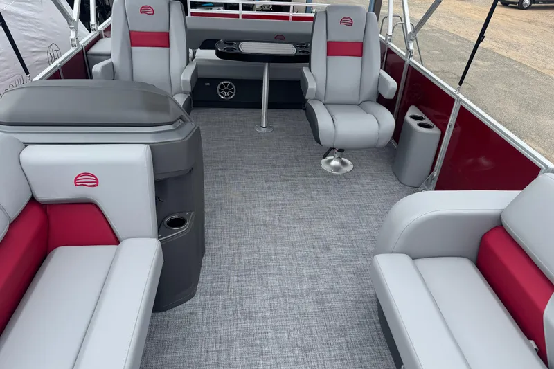 Slide: The Image of 2026 Sun Tracker Party Barge 22 RF DLX interior with gray and red seating, modern design. - 6