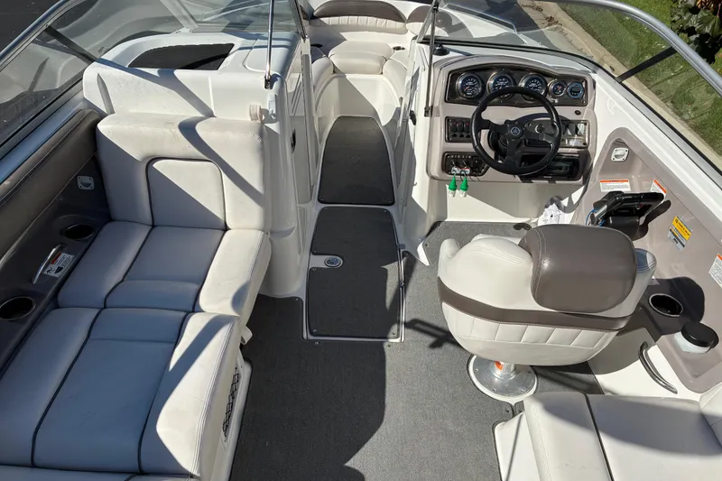 Slide: The Image of 2007 Yamaha Boats SX230 interior with steering console and seating area. - 14