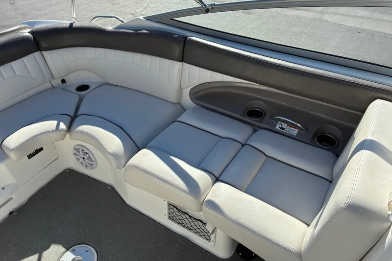 Slide: The Image of 2007 Yamaha Boats SX230 interior seating with cup holders and speaker. - 15
