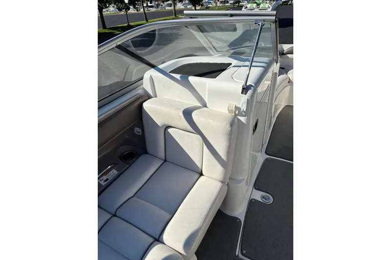 Slide: The Image of 2007 Yamaha SX230 boat interior with white seating and windshield. - 16