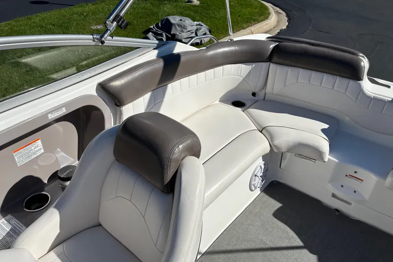 Slide: The Image of 2007 Yamaha Boats SX230 interior seating with white and gray upholstery. - 17