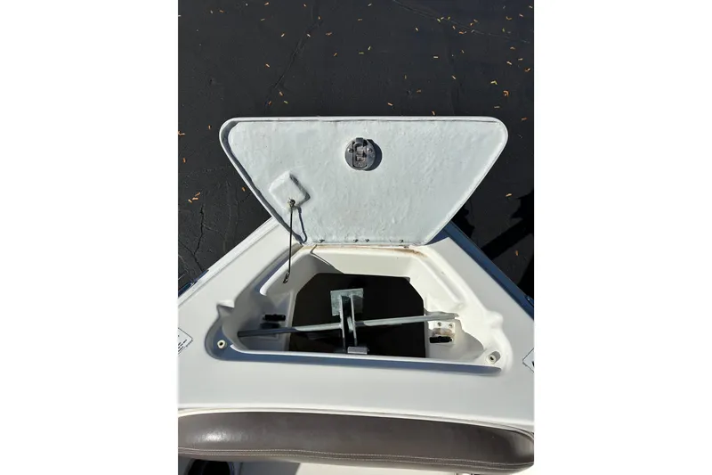 Slide: The Image of Open anchor compartment on 2007 Yamaha Boats SX230, showing storage space and mechanism. - 6