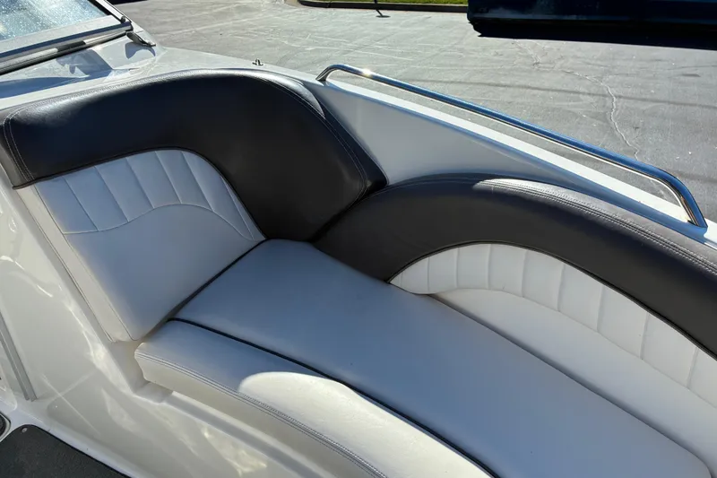 Slide: The Image of 2007 Yamaha SX230 boat interior with black and white cushioned seating. - 8