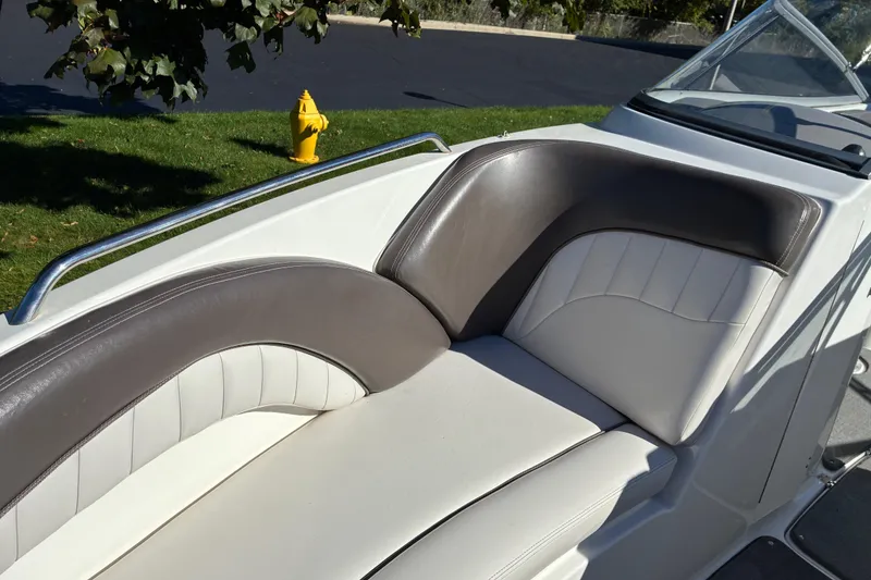 Slide: The Image of 2007 Yamaha Boats SX230 interior seating with gray and white upholstery. - 9