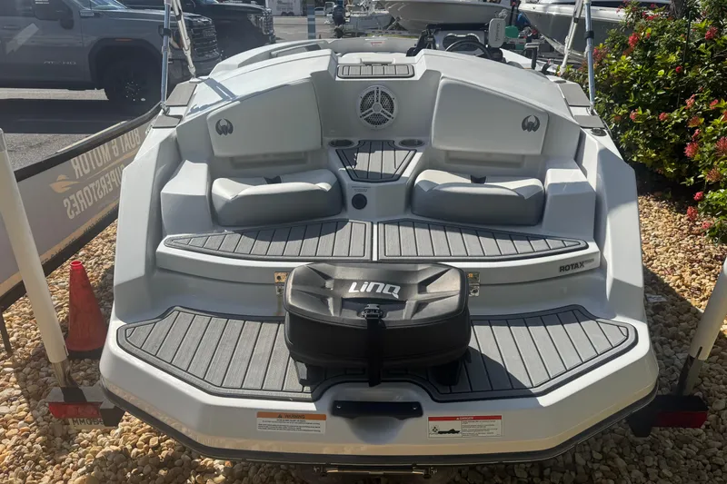 Slide: The Image of 2018 Scarab 165 G boat with seating and storage, displayed outdoors. - 12