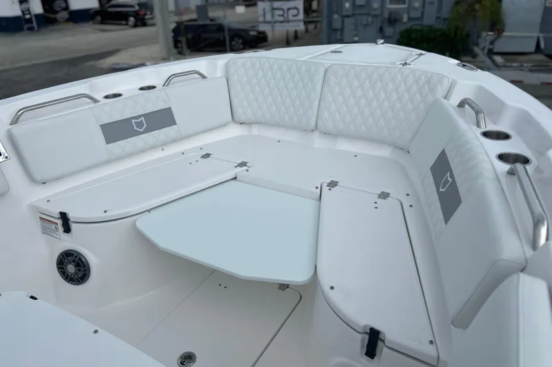 Slide: The Image of 2026 Sea Fox 268 Commander boat interior with white seating and table. - 10