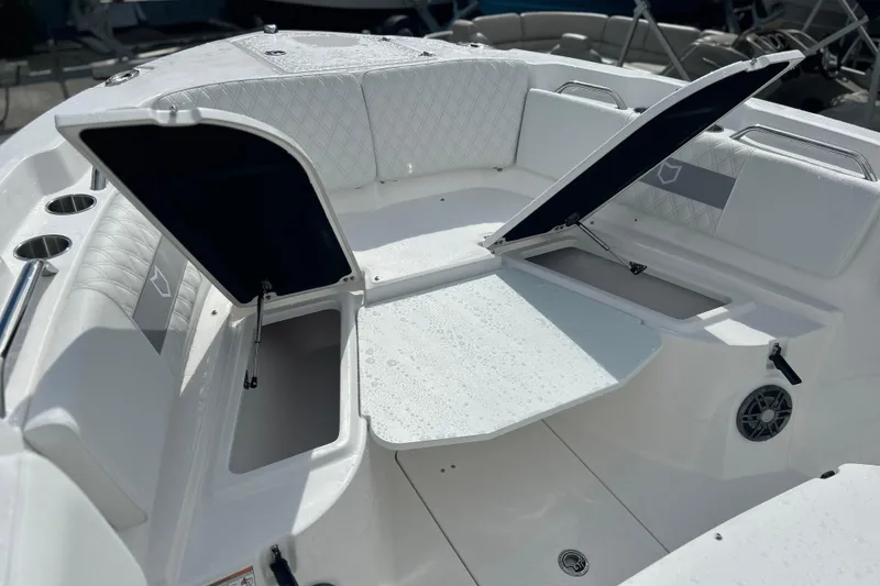 Slide: The Image of 2026 Sea Fox 268 Commander boat interior with open storage compartments and seating. - 11