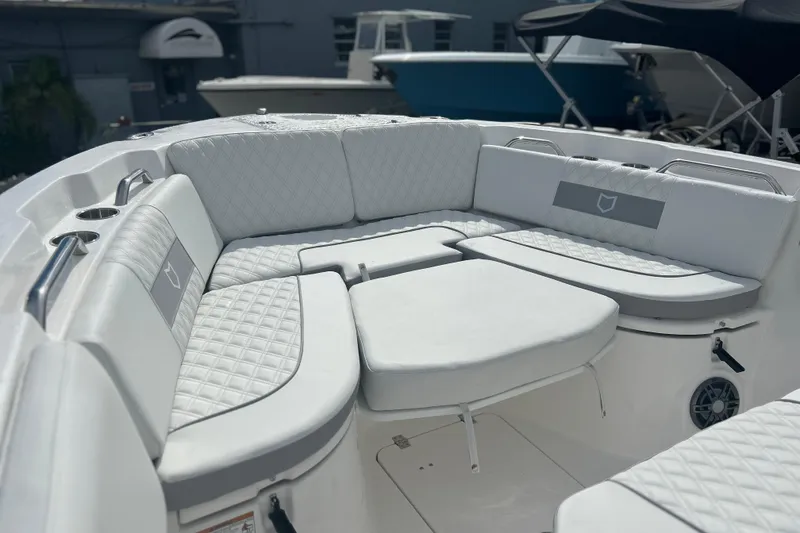 Slide: The Image of Luxurious seating area on 2026 Sea Fox 268 Commander boat, featuring quilted white upholstery. - 16
