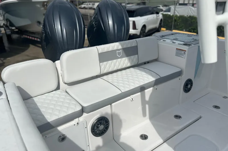 Slide: The Image of 2026 Sea Fox 268 Commander boat interior with cushioned seating and dual engines. - 25