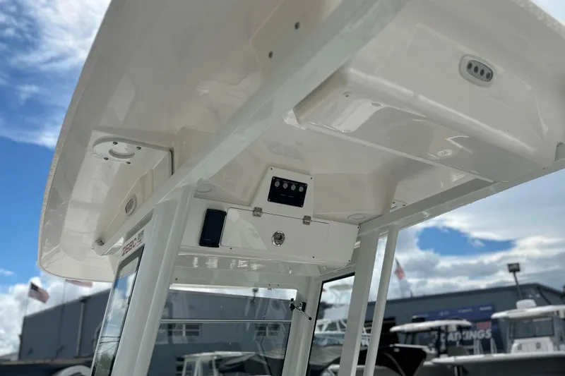Slide: The Image of 2026 Sea Fox 268 Commander boat console under a clear blue sky. - 30