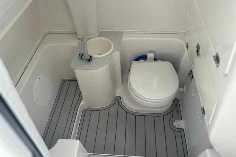 Slide: The Image of 2026 Sea Fox 268 Commander boat bathroom with toilet and sink. - 33
