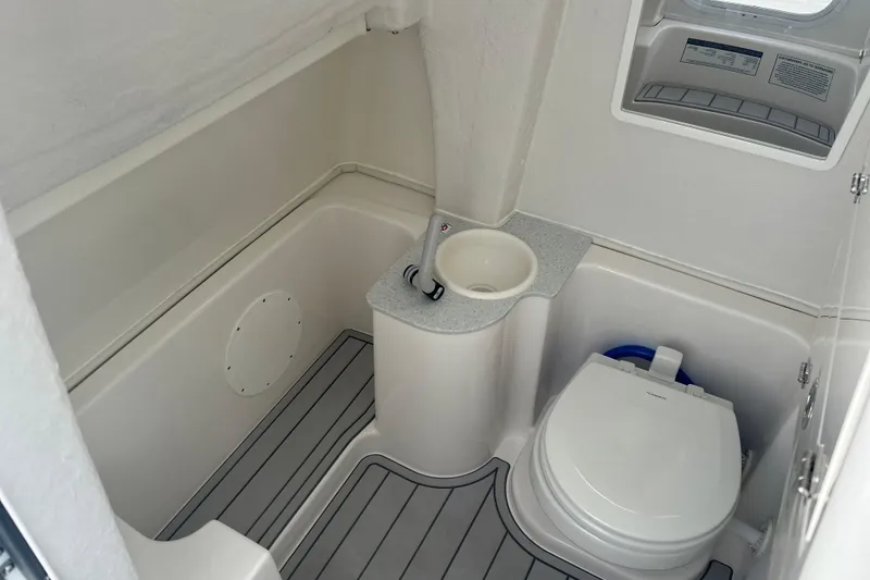 Slide: The Image of 2026 Sea Fox 268 Commander boat bathroom with toilet and sink, featuring modern design. - 34