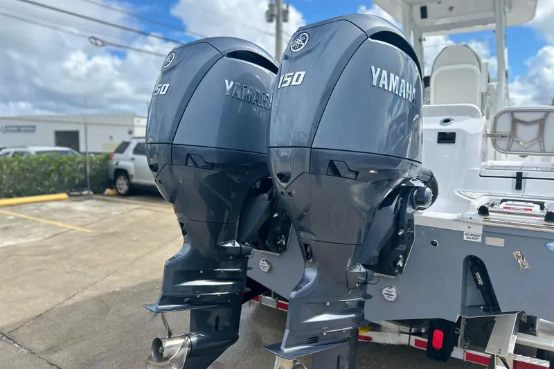 Slide: The Image of 2026 Sea Fox 268 Commander with dual Yamaha 150 engines, parked outdoors. - 38