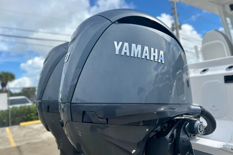 Slide: The Image of Yamaha outboard engines on a 2026 Sea Fox 268 Commander boat, under a clear sky. - 39